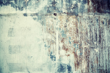 Old grungy concrete wall background, color toning applied.