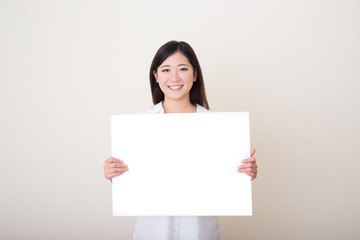 young asian woman with white board