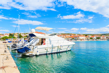 Fototapeta na wymiar Motorboat in Primosten port on sunny summer day, Dalmatia, Croatia