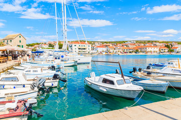Obraz premium Fishing boats in Primosten port on sunny summer day, Dalmatia, Croatia