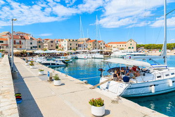 PRIMOSTEN, CROATIA - SEP 5, 2017: sailing boat anchoring in Primosten port, Dalmatia, Croatia.