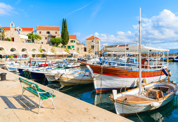 Fototapeta na wymiar Colorful fishing boats in Bol port, Brac island, Croatia