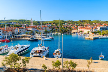 View of Supetar port with sailing boats and colorful houses on Brac island, Croatia