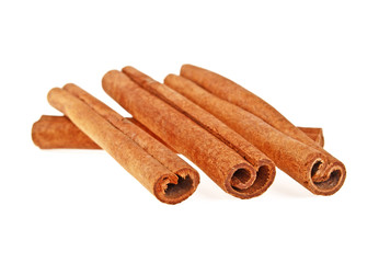 Cinnamon sticks over white background