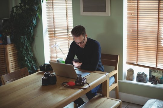 Man at desk using laptop
