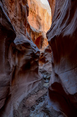 deep narrow passage at the bottom of Peek-a-boo Slot Canyon 
Grand Staircase Escalante National...