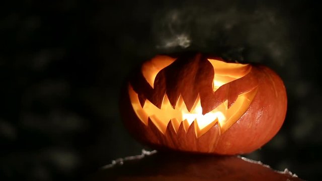Burning pumpkin on Halloween. Looped