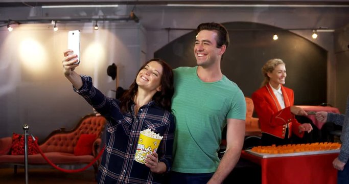 Couple taking selfie with mobile phone 