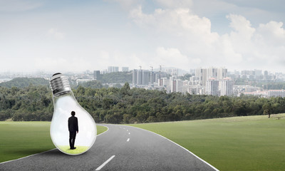 Businessman inside light bulb