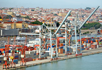 Industrial sea port with containers and cranes.