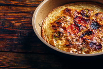 Frittata with chorizo, tomatoes and chili peppers.