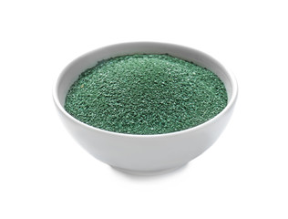 Bowl with spirulina powder on white background