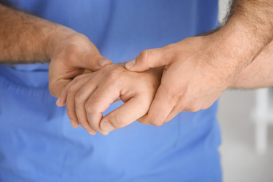Physiotherapist working with elderly patient, closeup