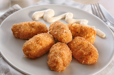 Delicious salmon croquettes on plate, closeup