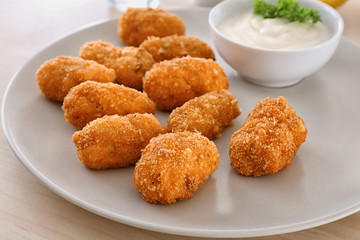 Delicious salmon croquettes on plate, closeup