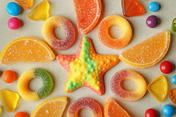 Colorful candies beautifully arranged on light background