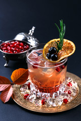 Fresh vodka and pomegranate and orange juice coctail, closeview