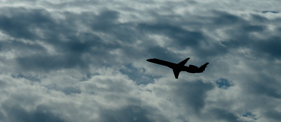 Jet Airplane Silhouette With White Cloud Background