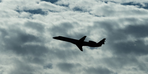 Jet Airplane Silhouette With White Cloud Background