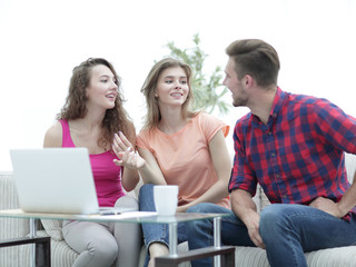 group of students to discuss the problem sitting on the couch.