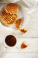 Cup of tea and waffle, top view. Copyspace