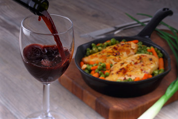 Pouring red wine into glass