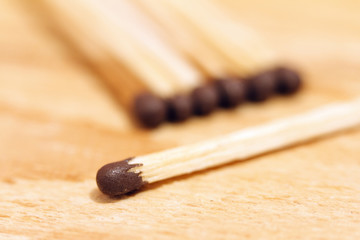Matches close-up on a wooden background