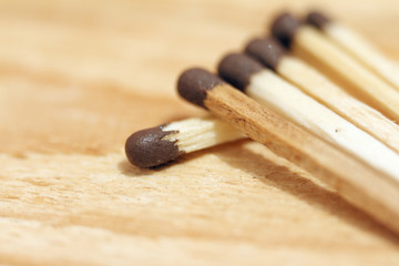 Matches close-up on a wooden background