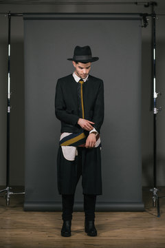 Studio shot of a fashionable man getting ready behind the scenes