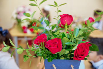 Red rose with teddy bear in box on wooden background,Love
