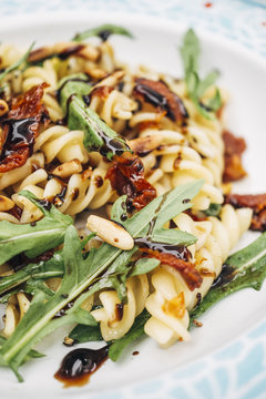 Food: Summer Salad with Noodles, dried tomato, rocket, roasted pine nuts and balsamico