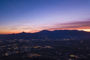 Aerial view of an incredible sunset behind the Italian mountains