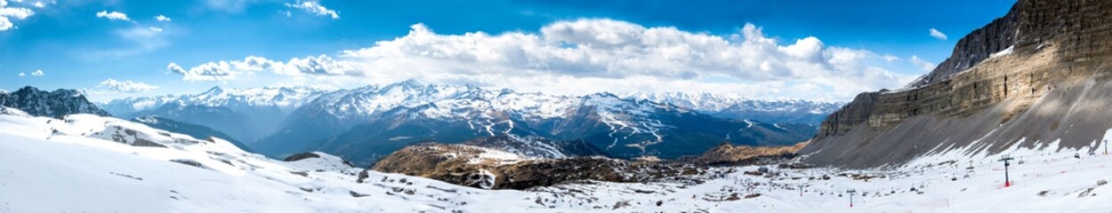 Fototapeta na wymiar Ultra wide panorama of popular alpine ski resort Madonna di Campiglio, Italy