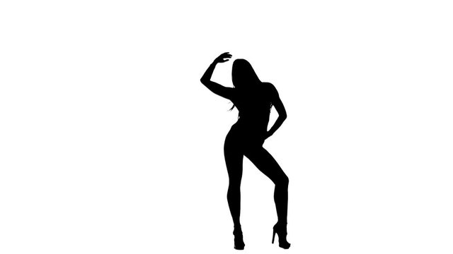 Girl gracefully moves to the camera. Silhouette. White background