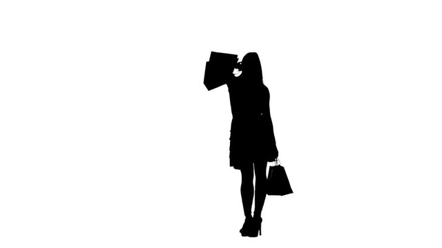 Girl was shopping at the store. Silhouette. White background. Slow motion