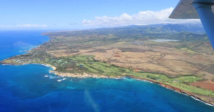 Aerial POV Kauai Hawaii beautiful blue ocean coast no sound. POV flying airplane. Kauai is the oldest Hawaiian Island. Garden Isle. Waimea Canyon State Park and Na Pali coast.