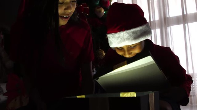 Children Opening a Magical Christmas Gift