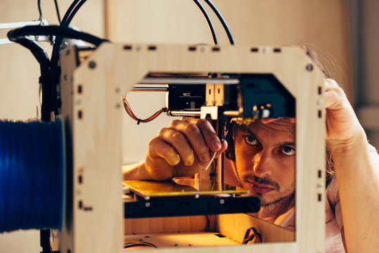 Technician working with 3d printer