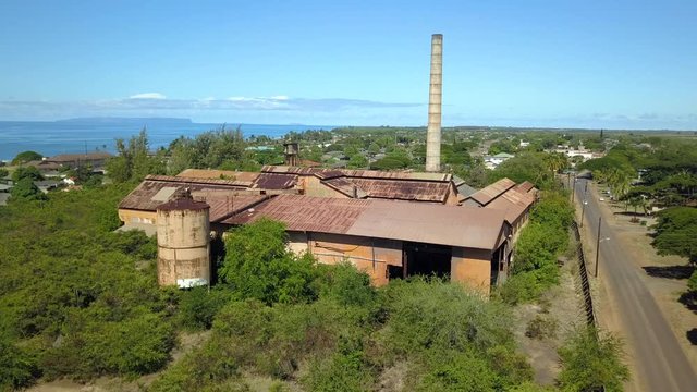 Aerial Kekaha Kauai Hawaii abandoned sugar mill building. Old abandoned and derelict Sugar Mill. Koloa was first built 1835. Rusty building and equipment. Kauai is the oldest Hawaiian Island.