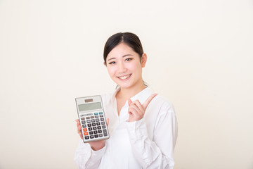 asian young woman with calculator