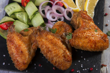 fried chicken wings with vegetables