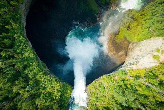 Fototapeta Aerial view of waterfall in forest