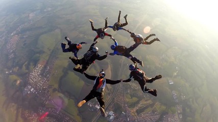 Skydivers at the sunset
