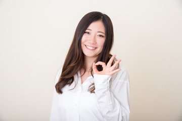 young asian woman with okay sign