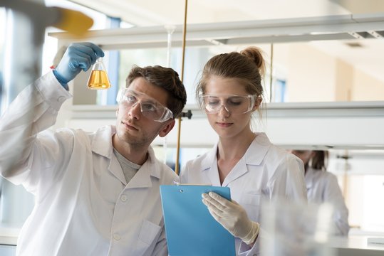 Students doing experiment in laboratory