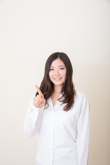 asian woman pointing with index finger