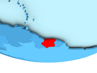 Suriname in red on blue map