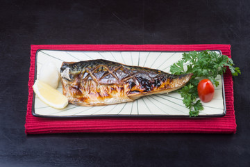 japanese cuisine. fried fish on the background