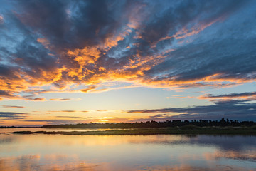 Naklejka na ściany i meble Sunset at the Mekong River look from Thailand to Laos.