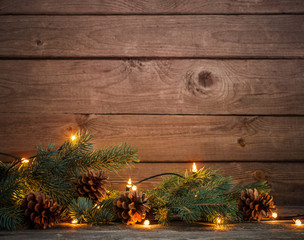 Christmas fir branches with cones and garland